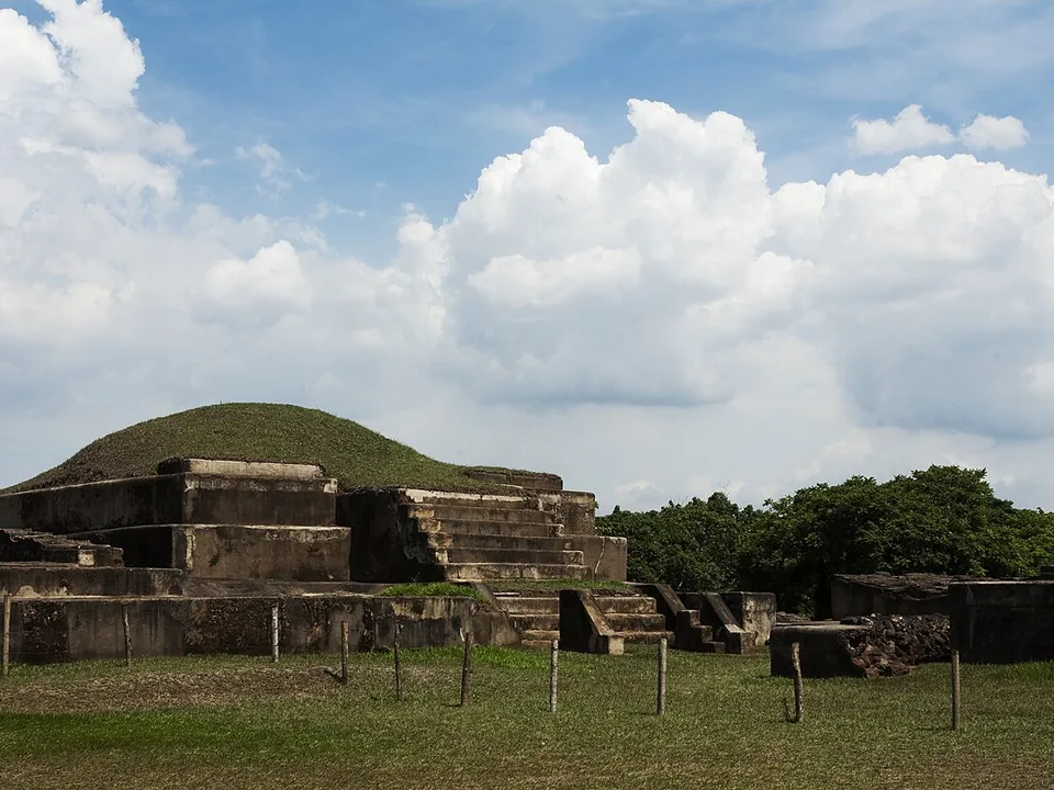 Wide view of multiple platforms and structures at San Andrés Archaeological Park
