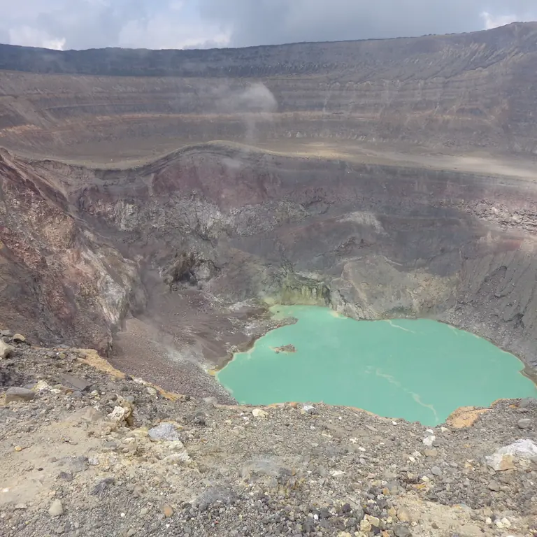 Turquoise crater lake at Santa Ana Volcano