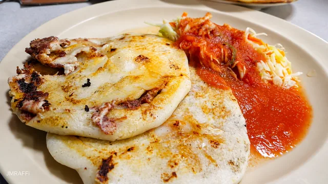 A freshly cooked Salvadoran pupusa ready to eat